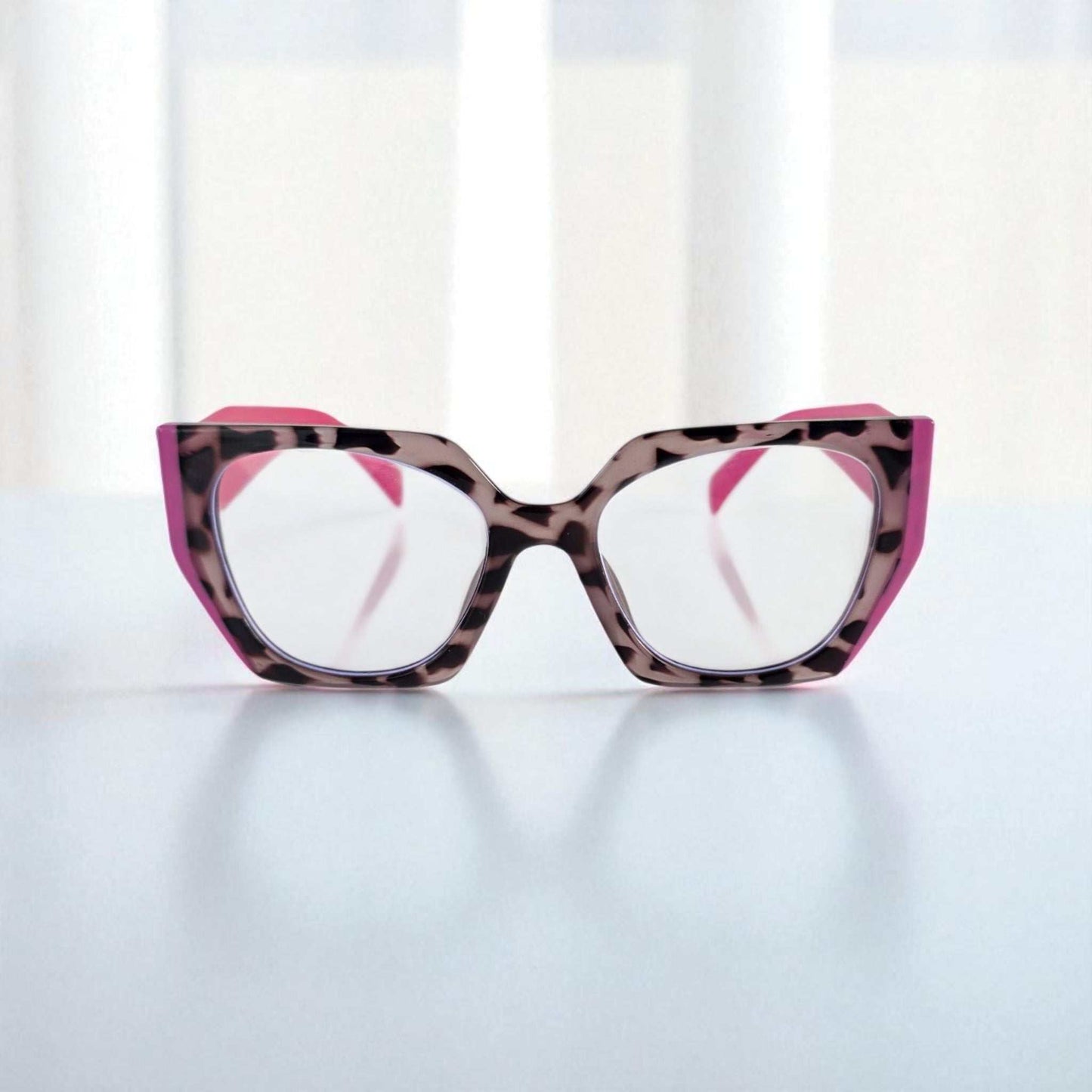 Pink and tortoiseshell reading glasses with blue light filter and stylish cat-eye frame