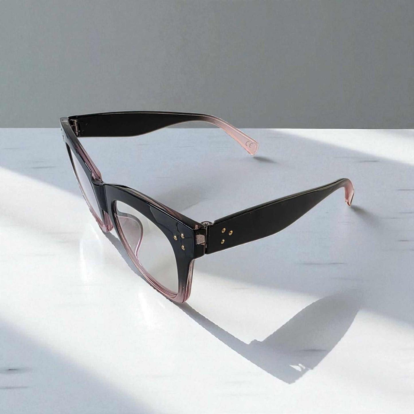 Black and crystal pink cat eye reading glasses with blue light filter and two-tone thick frames