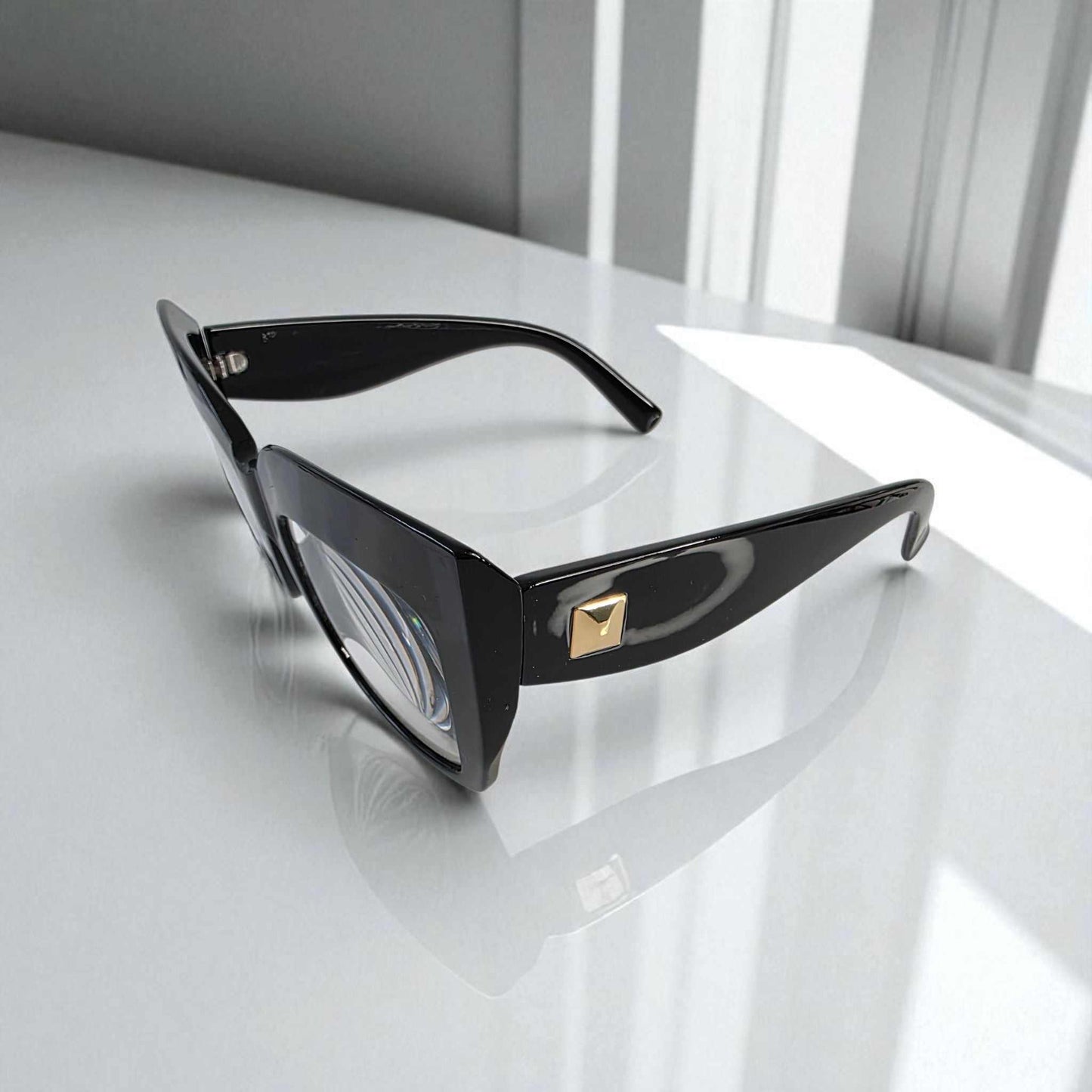 Black oversized cat eye reading glasses with blue light filter and stylish gold detail on temples