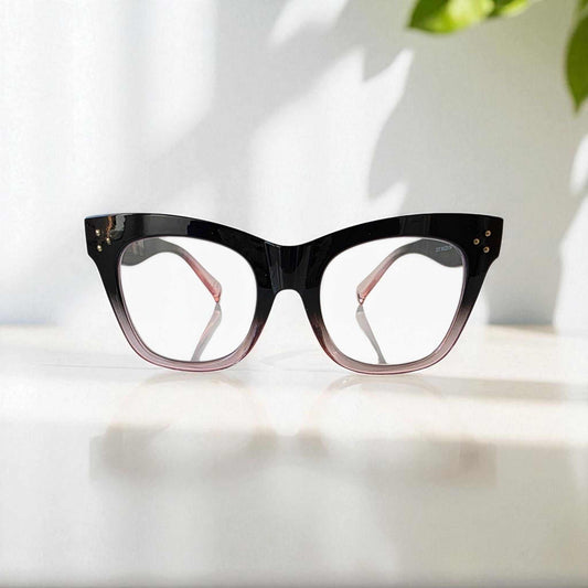 Black and crystal pink cat eye reading glasses with blue light filter and two-tone thick frames