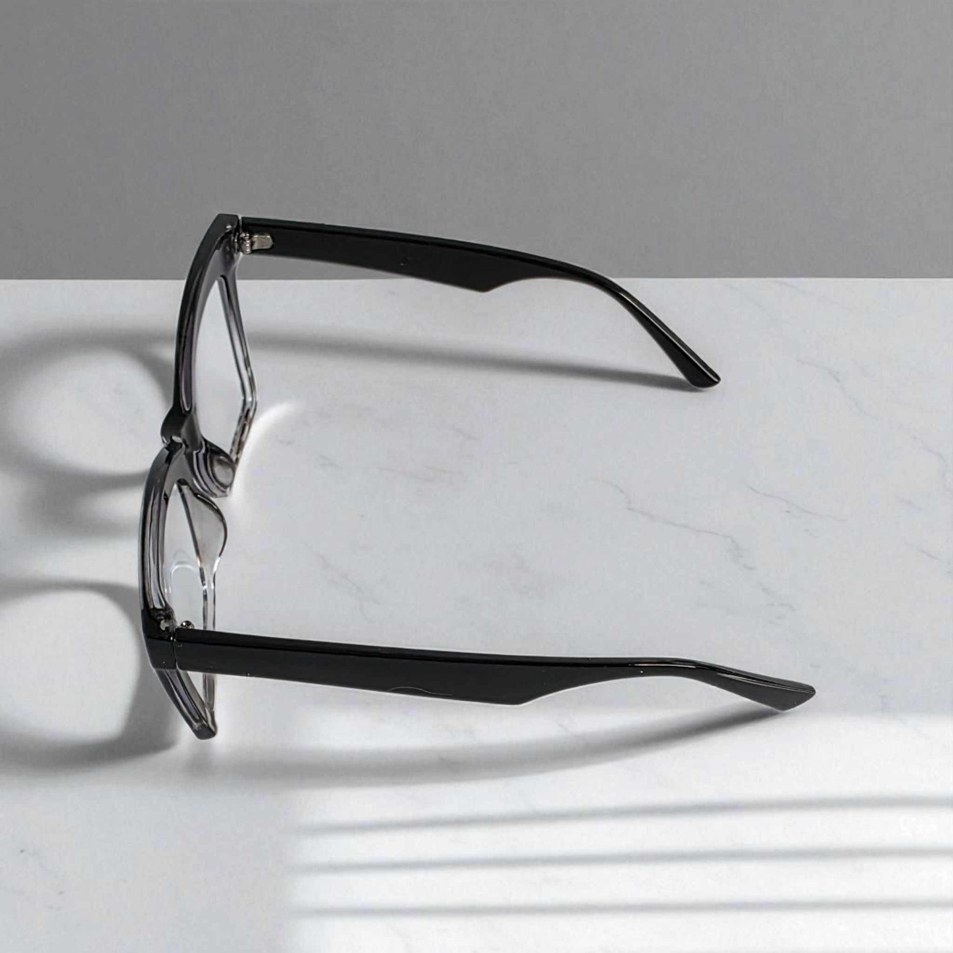 Animal Print Black crystal reading glasses with blue light filter and square frames on white marble background
