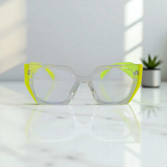 Neon Yellow Reading Glasses with blue light filter on reflective surface